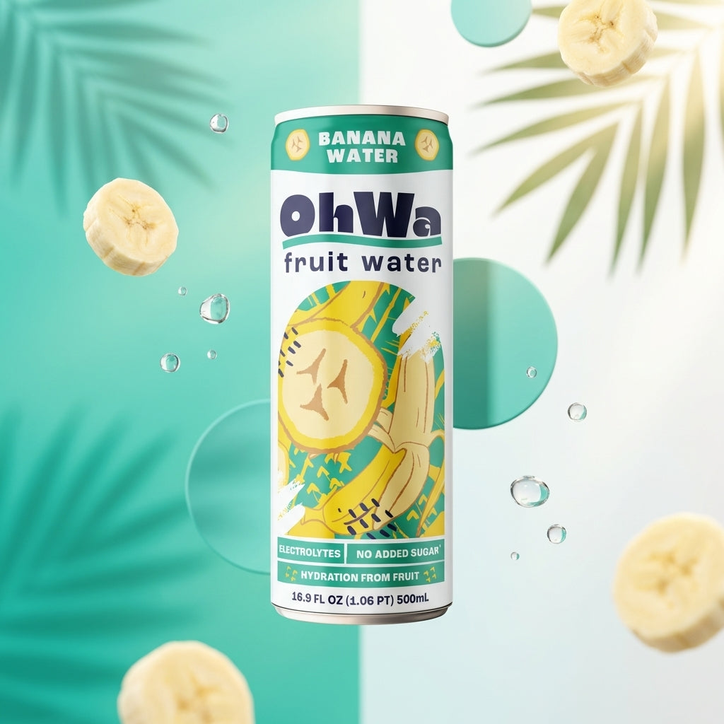 Can of ohWa banana fruit water with banana slices and leaves on a light blue background