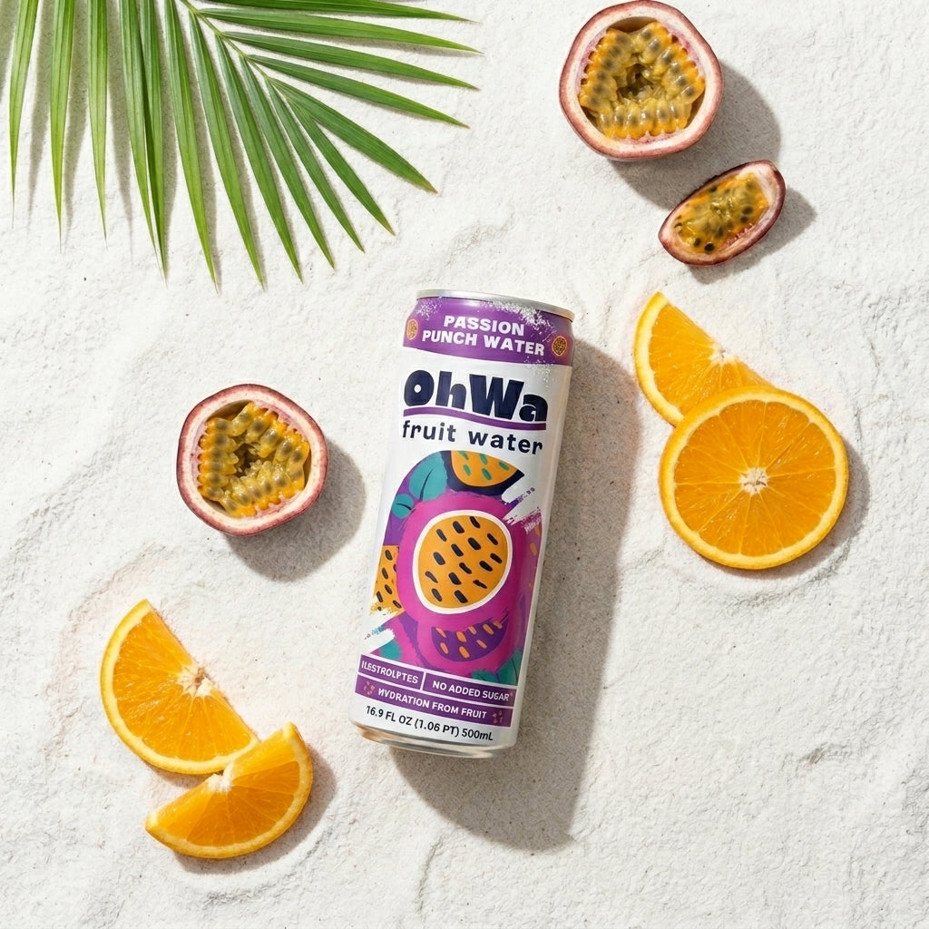 An overhead shot of a can of OhWa Passion Punch fruit water on the beach