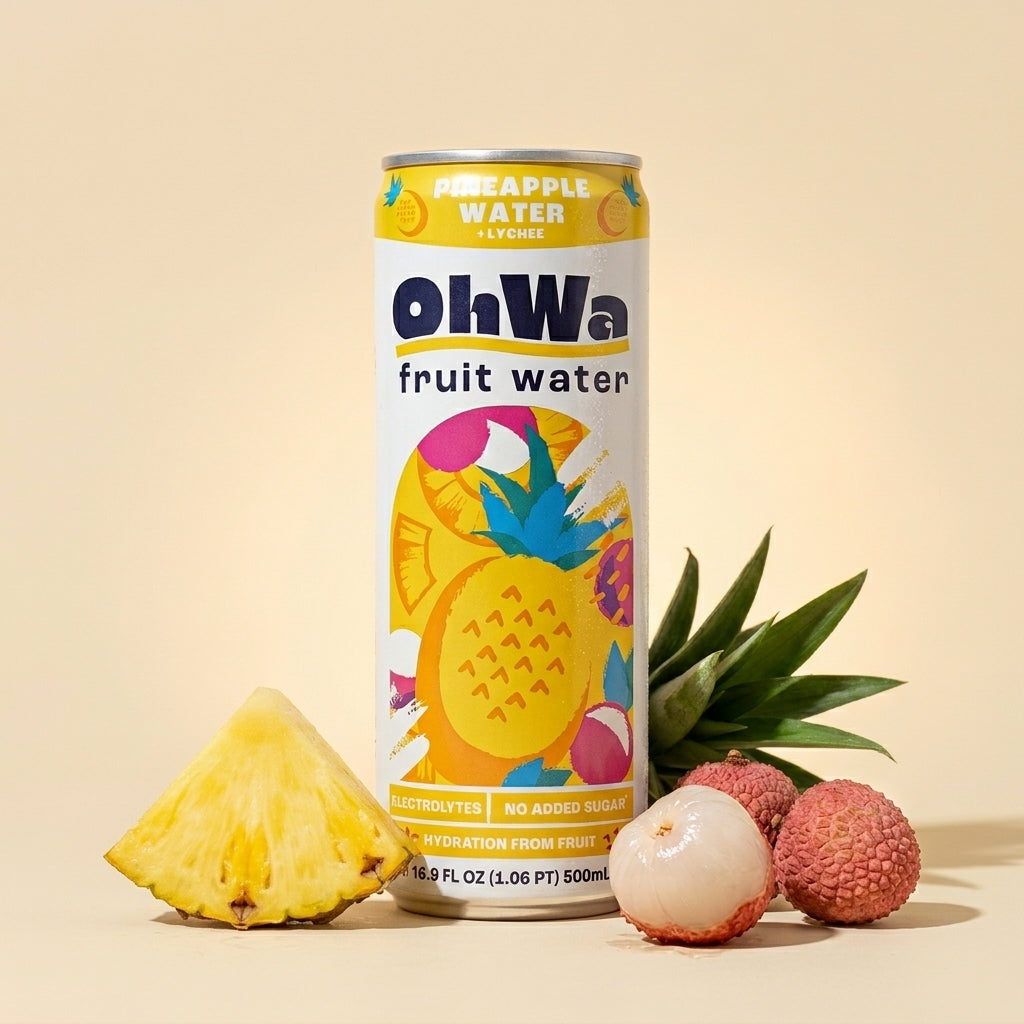 OhWa pineapple fruit water can with a pineapple and lychees on a beige background
