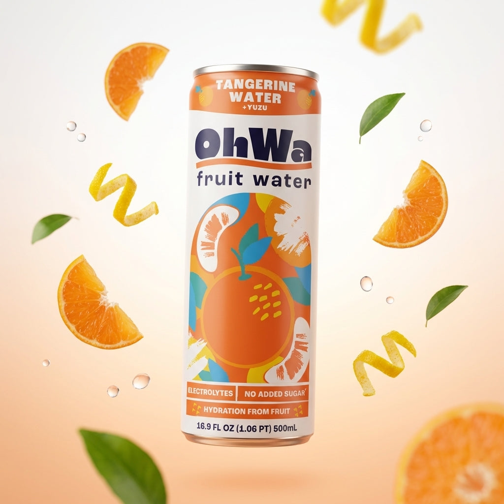 Can of ohWa tangerine water with fruit slices and leaves on a light background